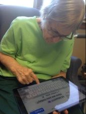Older women messaging someone on an iPad