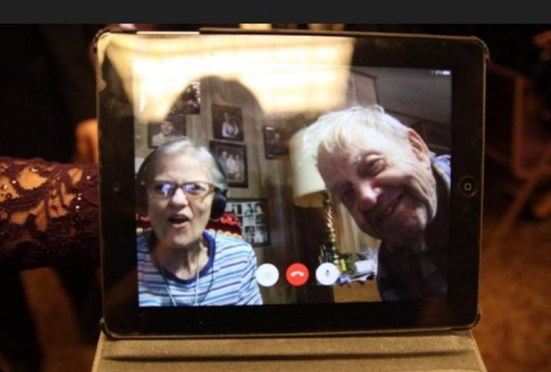 An older woman and older man on an iPad