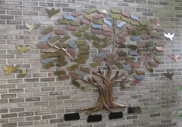 Giving Tree on a brick wall
