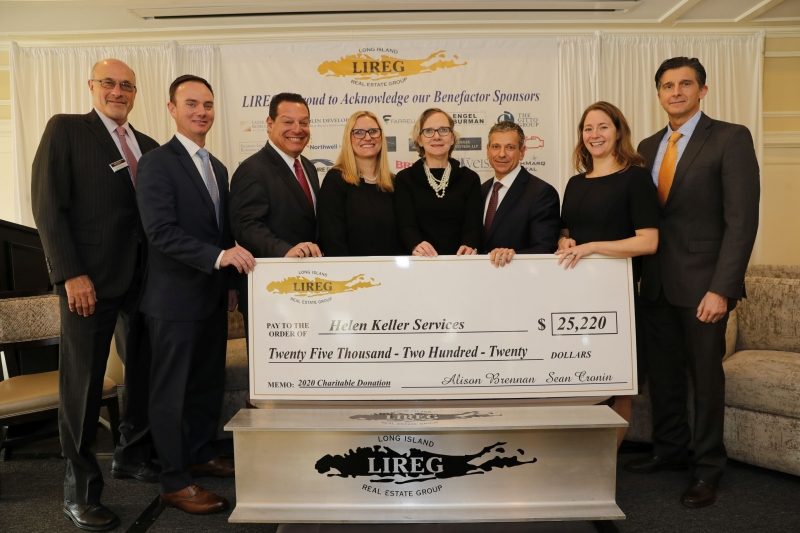 LIREG Executive Board presenting an oversized check to Helen Keller Services for the Blind for the Low Vision Center improvements.