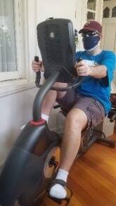 A man using an exercise bike