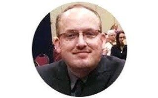 Chris Woodfill smiling into the camera