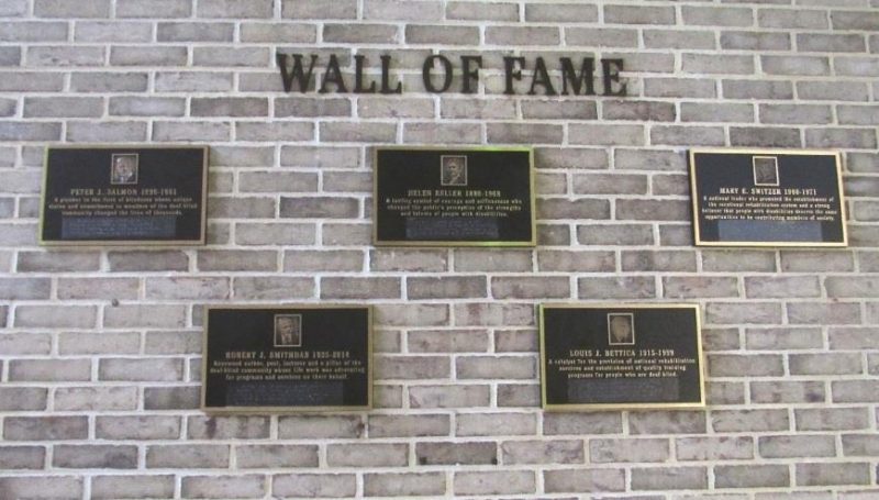 Wall of Fame showing 5 plaques against a brick wall