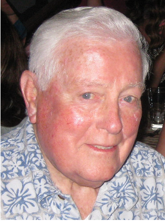 Philip F Stenger, an older man, looking into the camera and wearing a blue and white floral shirt