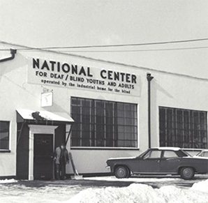 Sign that says “National Center for Deaf / Blind Youths and Adults” on the front of a building