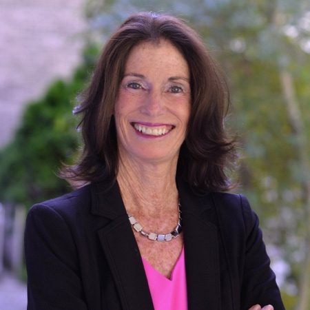 Elizabeth Meade standing outside and smiling into the camera