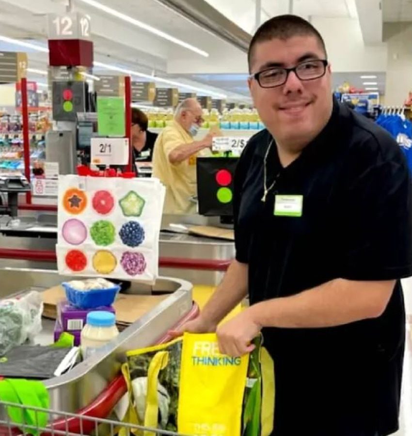 A young man working in a retail store.