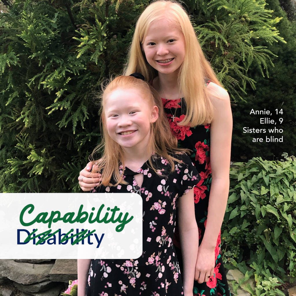 Two young girls wearing floral dresses. Text on image says “Capability Disability” and “Annie, 14, Ellie, 9, Sisters who are blind”