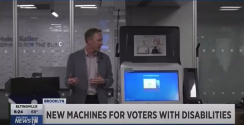 Man looking at new voting machine