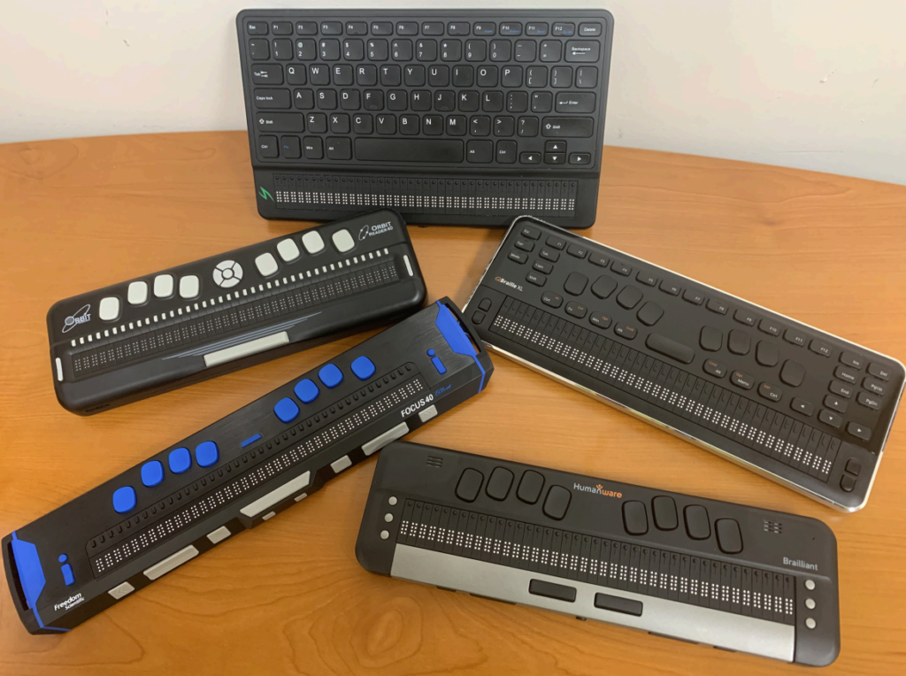 5 braille displays on a table