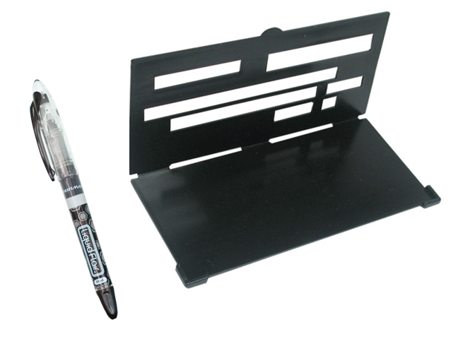 A black and clear pen, and a black foldable device with rows of thick, varying sizes of rectangles cut out of it