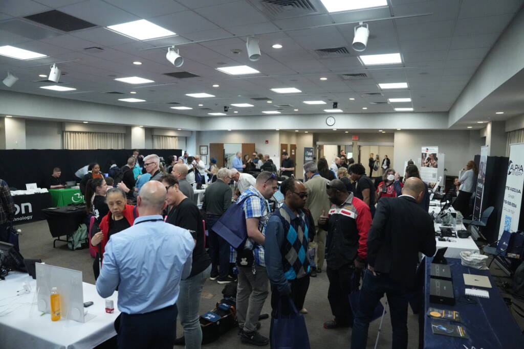 A wide angle shot of Helen Keller Services Tech blitz event filled with attendees and vendors.