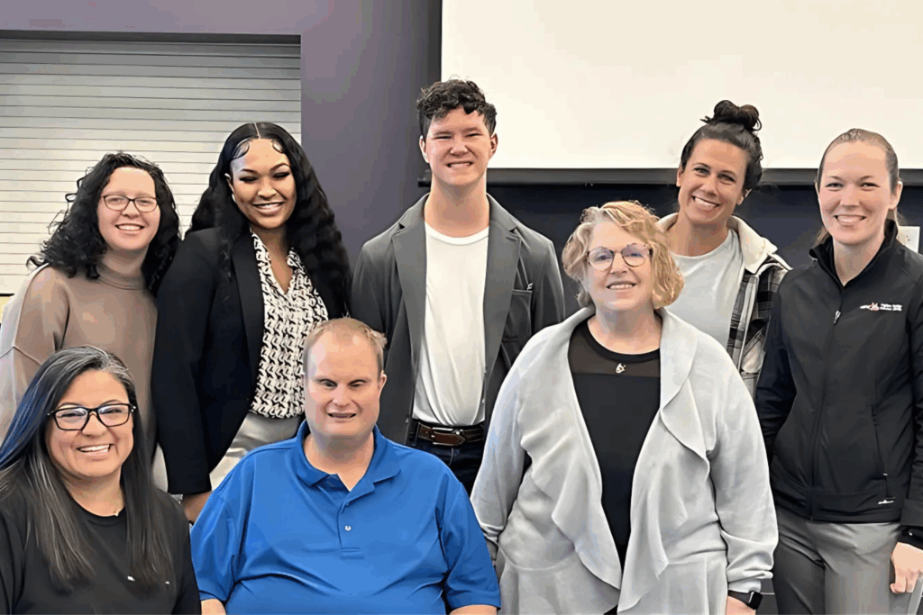 Group picture of eight people smiling. This is from the TN SSP Training that Anthony assisted with at the Nashville Bridges Deaf Center.