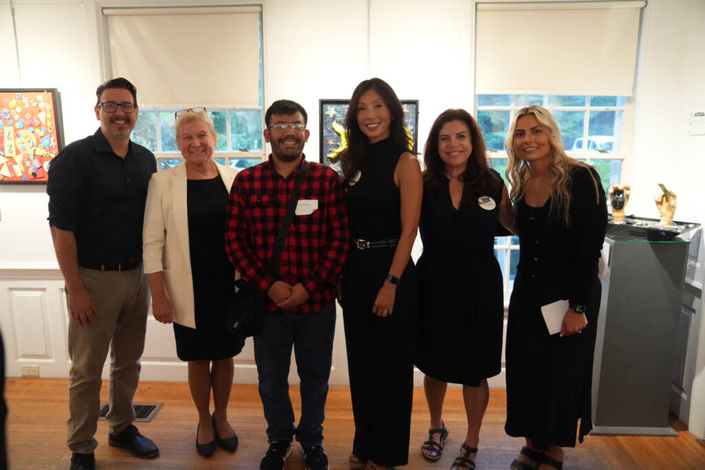 Group photo of HKNC/HKs leadership, Art Guild staff, an HKNC participant and HKNC's Art therapy instructor. 