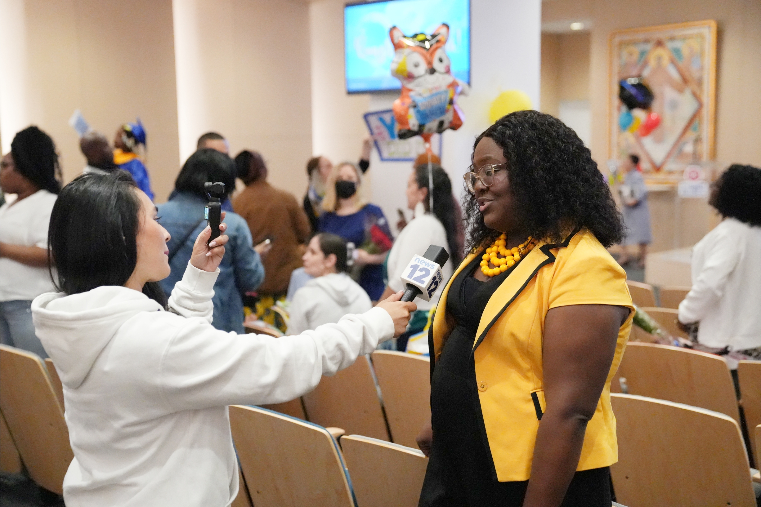 Dr. Avien Henry, Principal of the CLC, speaks to a News 12 reporter.