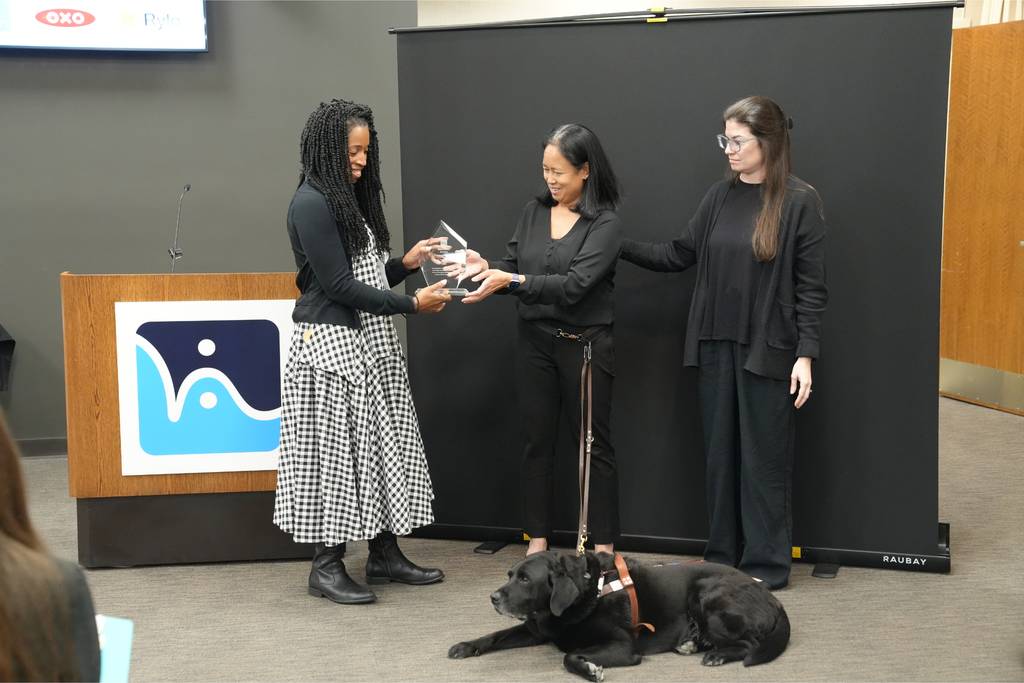 OXO receives its AccessAbility Award beside the HKS podium.
