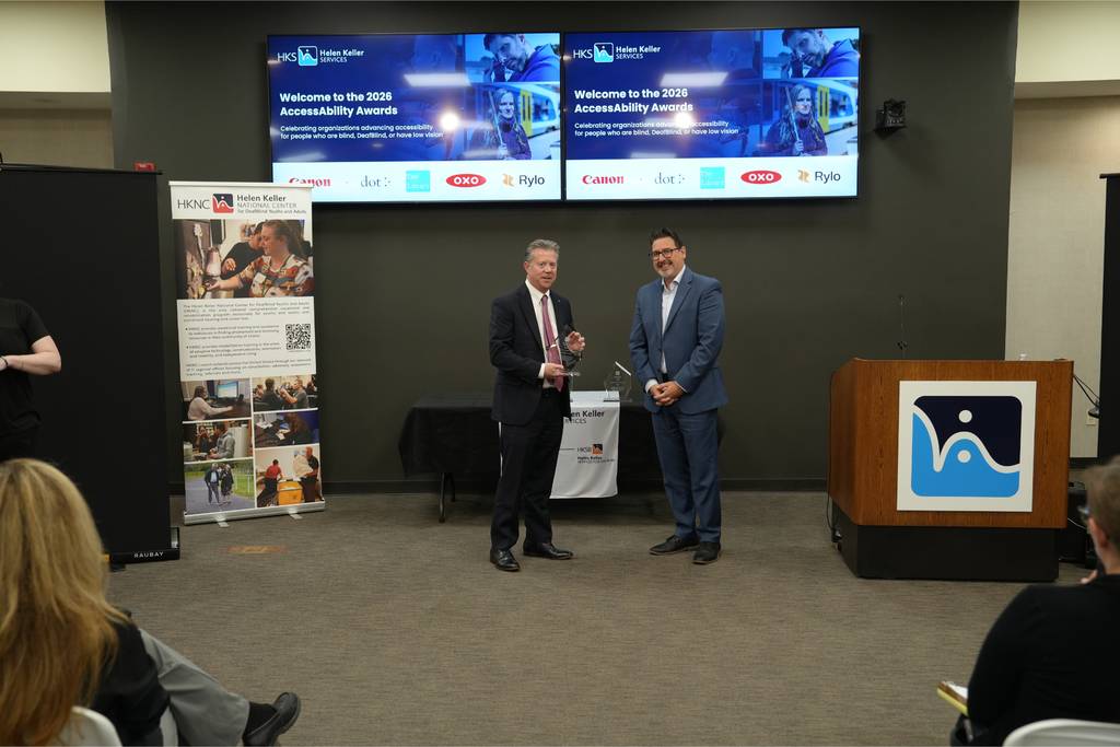 Canon U.S.A. accepts its AccessAbility Award.